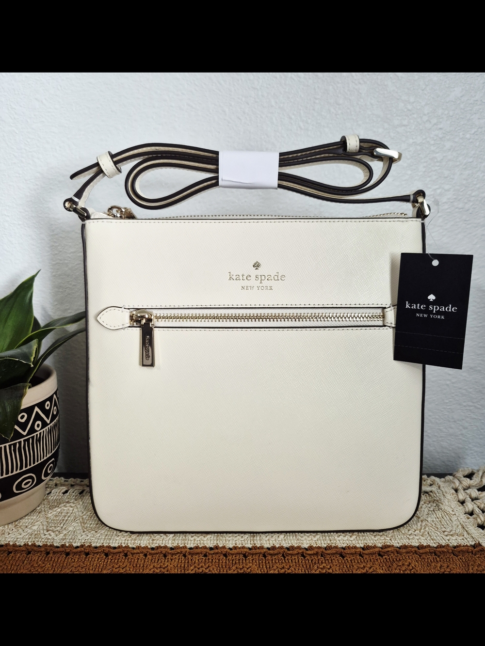 Kate Spade Sadie Cream Saffiano Leather crossbody with front zip